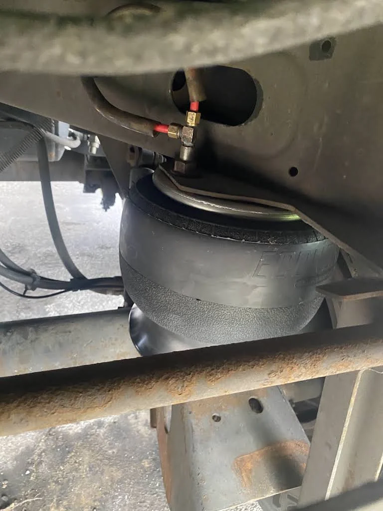 Truck air bag suspension repair close-up