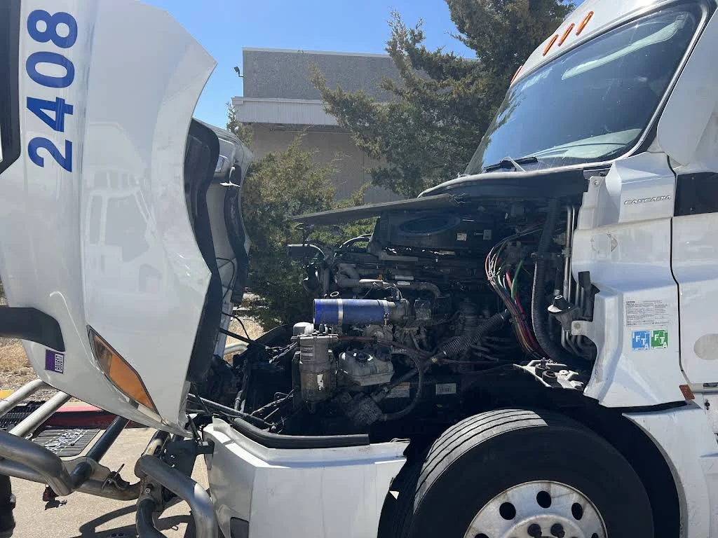 Open semi truck hood and engine bay