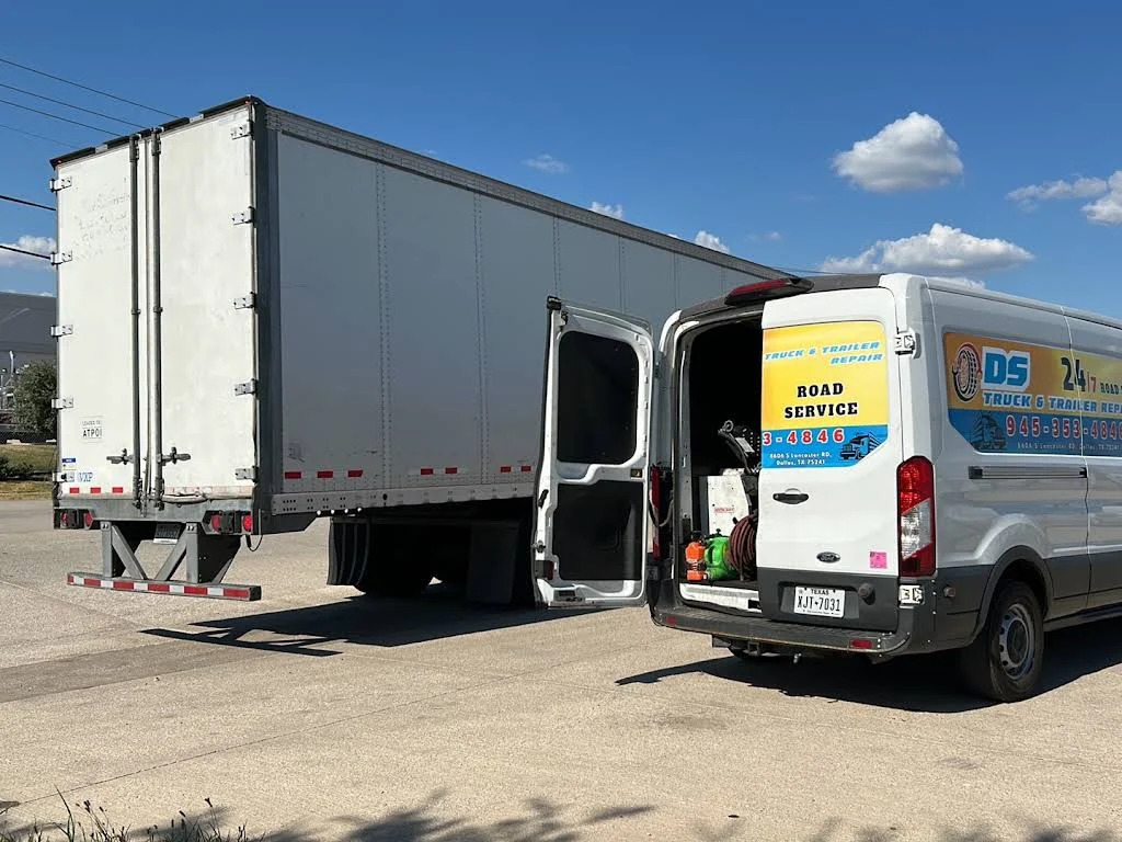 Trailer beside a DS mobile service van
