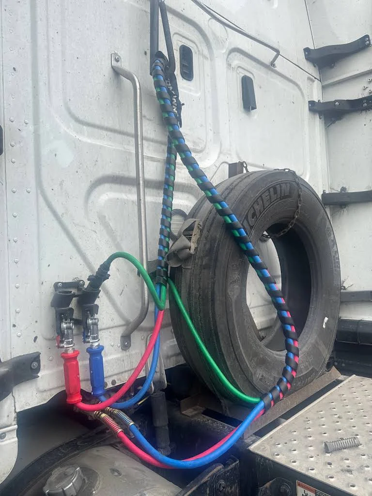 Truck air lines and spare tire