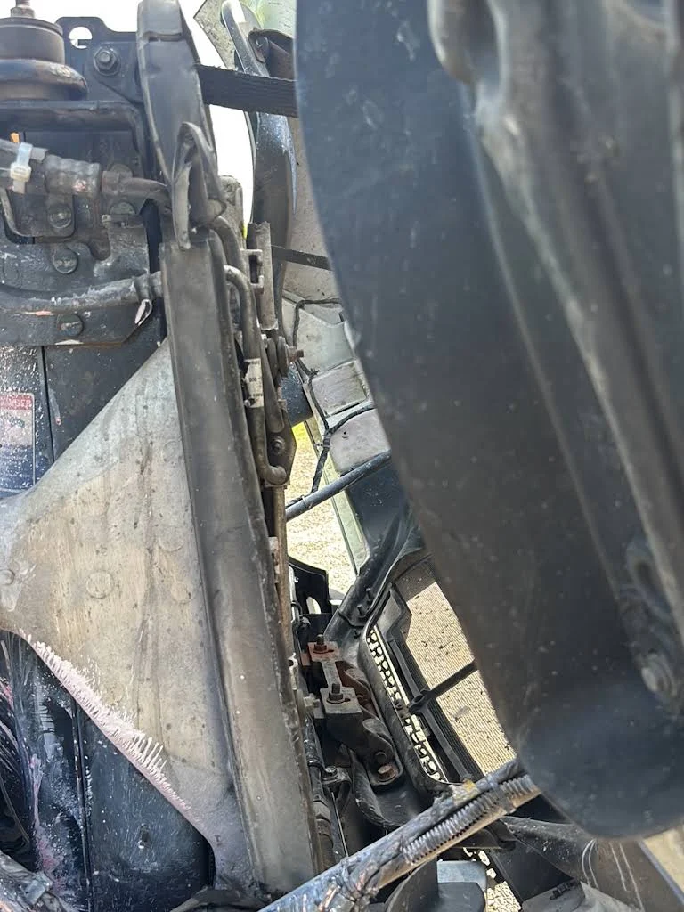 Truck radiator frame with engine parts