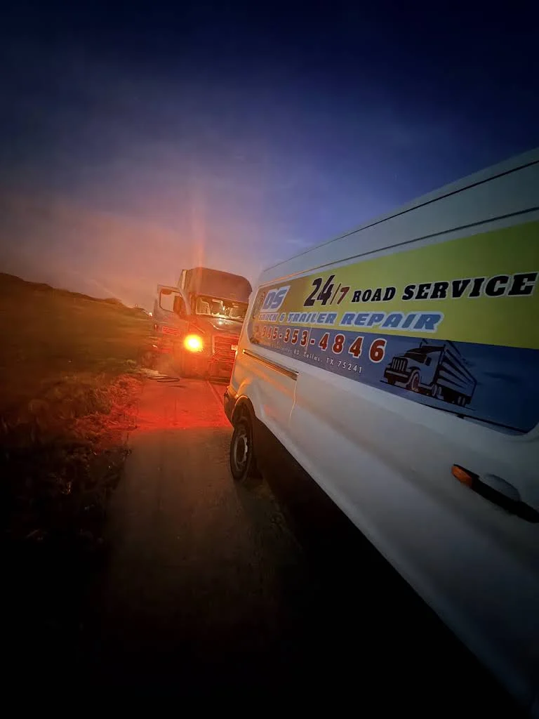 Roadside service van aiding semi-truck