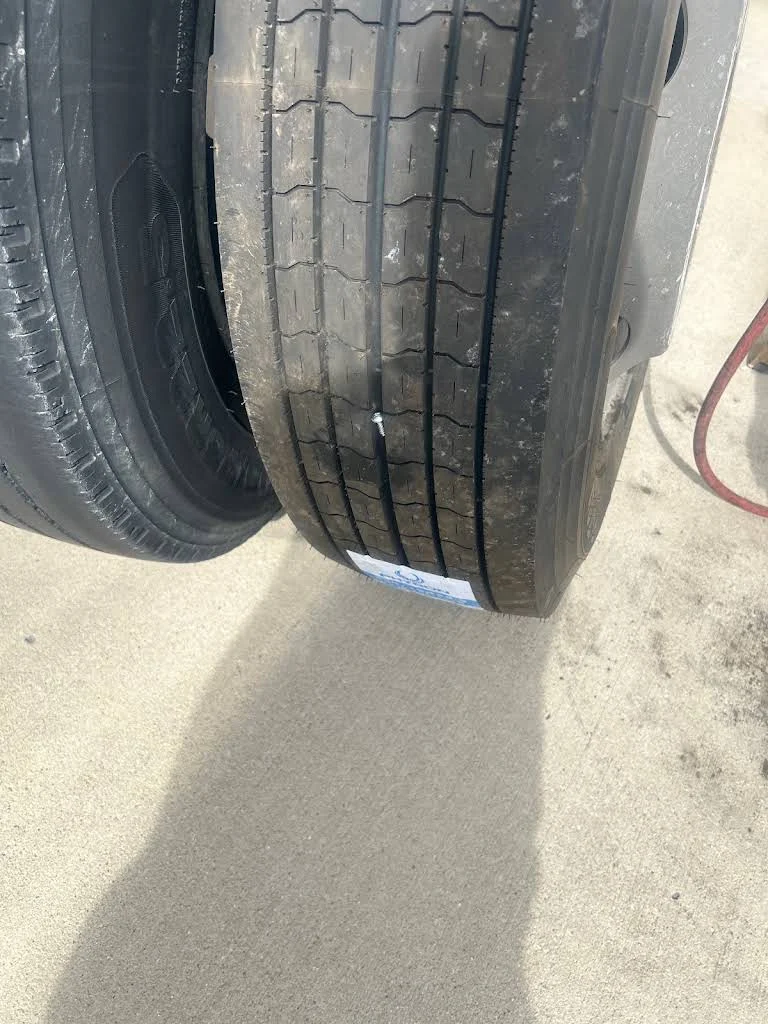 Truck tire with embedded screw